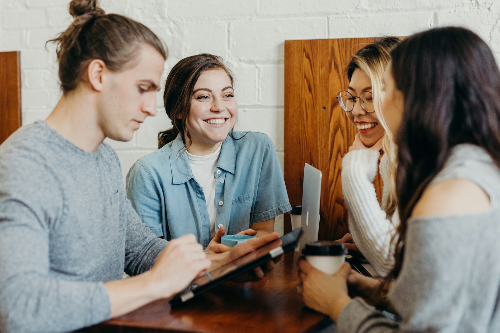 A group of students smiling while studying together